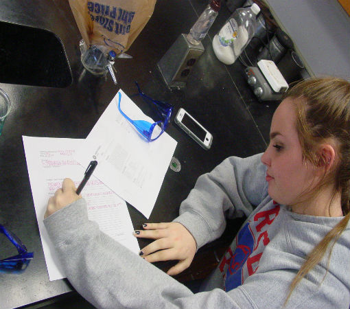 Rebecca records the results in the lab.